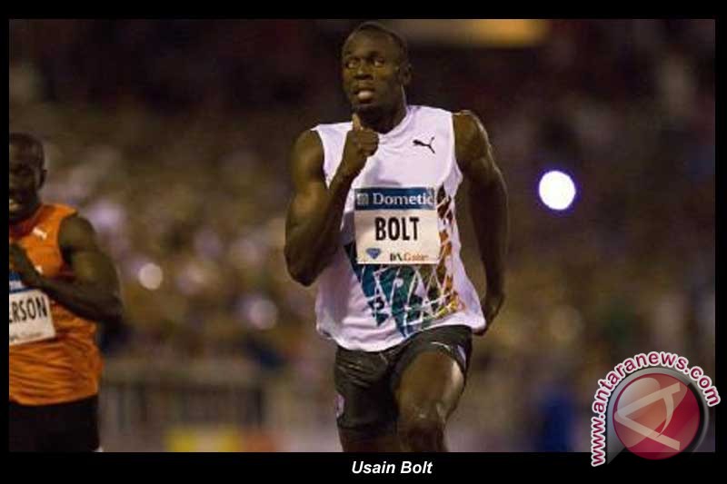 Bolt antar Tim Estafet Jamaika pecahkan rekor dunia Bolt antar Tim Estafet Jamaika pecahkan rekor dunia