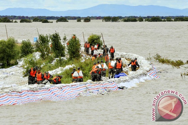 Banjir di China renggut 100 nyawa dan hancurkan sawah