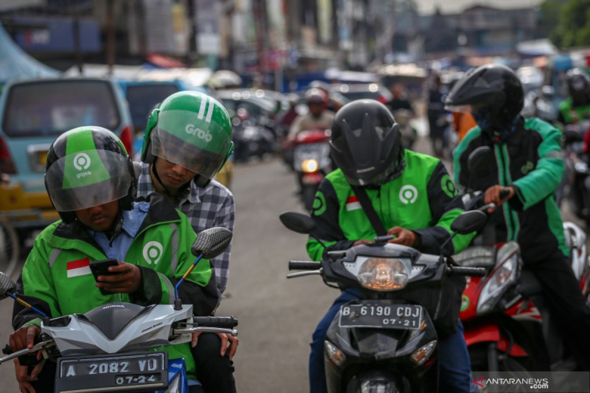 Amankah berpergian dengan ojek "online" di tengah pandemi corona?