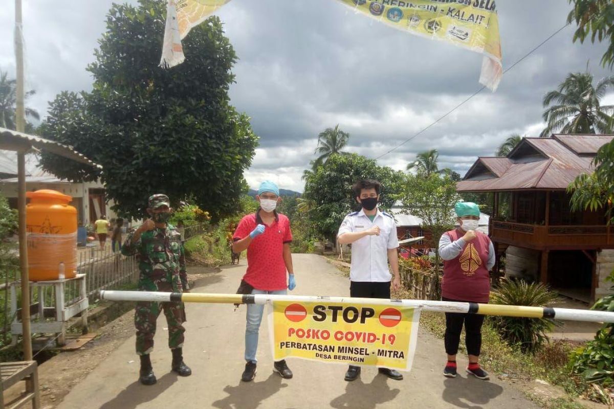 Anggota Kodim Minahasa aktif menjaga  pos pengawasan COVID-19