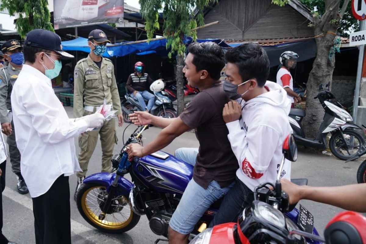 Hari Kesaktian Pancasila di Pati  diwarnai dengan pembagian masker