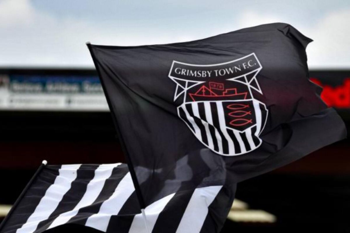 Grimsby Town didenda setelah memainkan pemain tak terdaftar lawan MU