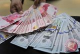 Rupiah diprediksi masih lanjut melemah pascaaksi kerusuhan