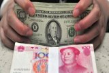 Yuan China melemah terhadap dolar AS