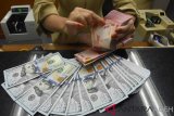 Rupiah ditutup menguat menjadi Rp14.155 per dolar AS