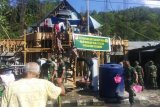 Kodim 1301 dan Polres Sangihe membantu pembangunan gereja