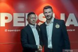 Bek anyar Persija Marco Motta semringah