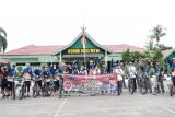 Kodim Muara Teweh dan BRI gowes bareng sambil berbagi