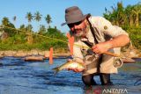 Memancing uang dengan ikan larangan