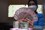 Rupiah menguat seiring BI tahan BI-Rate