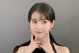 IU tulis lagu dalam album barunya