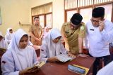 Daerah ini gerakan baca Al Quran untuk SMA, 15 menit sebelum belajar