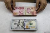 Rupiah menguat didukung peningkatan minat pelaku pasar terhadap lelang obligasi negara