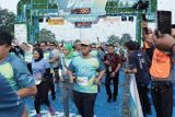 Lima ojol dapat sepeda motor listrik di PLN Electric Run 2024