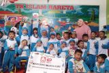 Dorong literasi anak, Alfamidi dan SGM Eksplor salurkan buku bacaan di Sulut