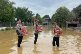 Kepolisian Patroli Banjir di Beberapa Desa di Kecamatan Tanjung Palas Timur