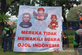 Ini tuntutan massa aksi ojol di kawasan Monas