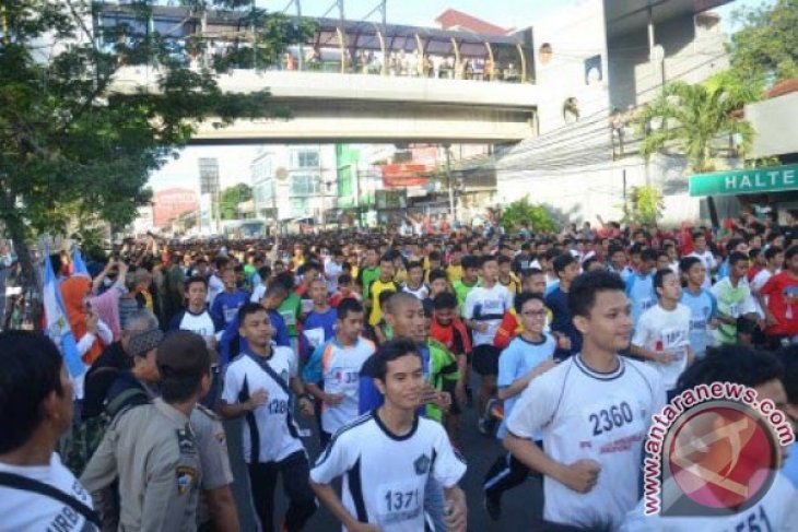 Agus Prayogo Raih Juara 10 K Depok