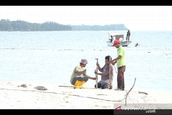 Workers begin construction of helipad on Sebaru Island