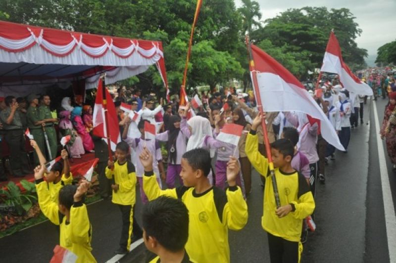 Melambaikan Bendera