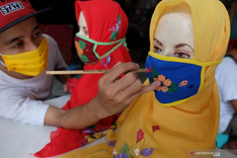 Produksi jilbab masker lukis